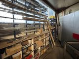 a room filled with lots of shelves and shelves with lots of wood