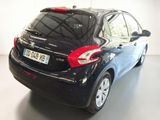 a black car that is parked in a white room