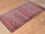 a rug on the floor in the middle of the room