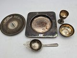 a lot of silver items that are on the table