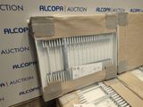 a lot of boxes of pens sitting on a table