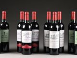 six bottles of wine are lined up in a row on a table