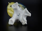 a figurine of a starfish and a banana on a table