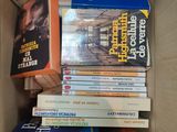 many books in the box on the couch
