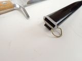 a knife and a cleaver on a table
