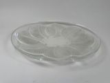 a glass plate with a design on it on a table