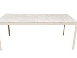 a white marble top dining table with metal legs