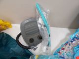 a bag of water and a vacuum on a counter