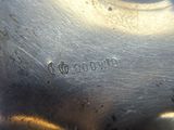 an antique silver plate with the name of a man on it