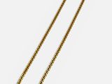 a gold necklace with an evil eye pendant on it