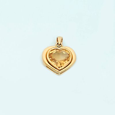 a yellow gold heart pendant with a citrine stone