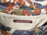 the back of a jacket with a floral pattern on it