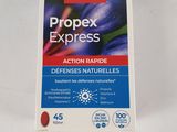 a close up of a packet of propex express pills on a white surface