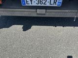 someone taking a picture of the back of a truck with their cell phone