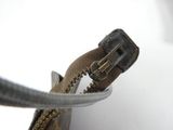 a close up view of a zipper on a purse