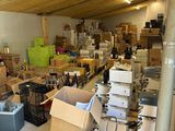 many boxes and boxes on the floor in the garage