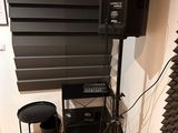 a speaker and a speaker stand in a room