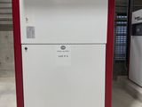 two refrigerators that are sitting in a garage