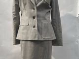 an image of a woman ' s dress and jacket on a mannequin