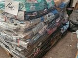 a pile of folded up clothes on a pallet
