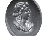 black and white photo of a sculpture of a woman in a headdress