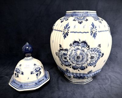 a blue and white vase next to a blue and white bowl