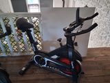 a stationary exercise bike in the corner of the room