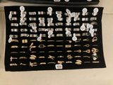 many different types of jewelry on display in this case