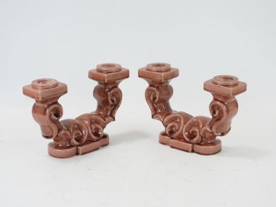 two candles that are sitting next to each other