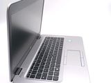 a laptop computer sitting on top of a white table