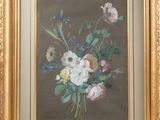 painting of a bouquet of flowers in a gold frame on a wall