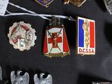 a lot of badges on a black table