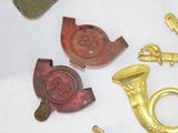 a lot of brass items that are on a table
