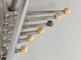 a close up of a set of stairs with wooden knobs