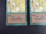 two cards that are sitting on a table