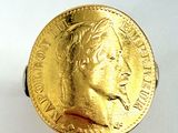 l'image d'une pièce d'or sur laquelle figure le visage d'un homme