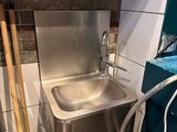 a sink in the corner of a bathroom being remodeled