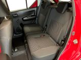 a red car with two seats in the back of it
