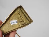a close up of a person holding a piece of metal