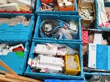 many boxes of assorted items sitting on the floor