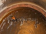 a brown pot with a brown substance inside of it
