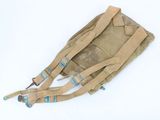 a close up of a bag on a white surface with straps