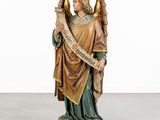 an image of a statue of an angel holding a scroll