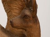 a statue of a deer with wings on it ' s head