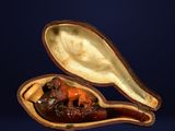 a small wooden spoon with some food inside of it