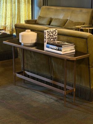 a living room with a couch and a table with a book on it