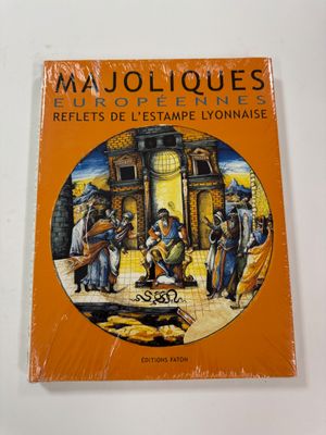 an orange book with a picture of a group of people in front of a building