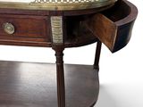 a wooden table with a marble top and drawers on it