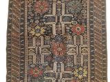 a blue and brown rug with a design on it