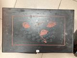 a black box with a red and black design on it
